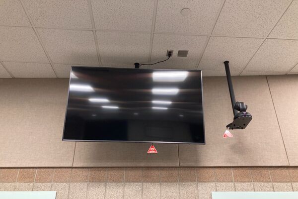 Monitor mounted so that students will be able to see remote participants without having to turn to look at the projection screen